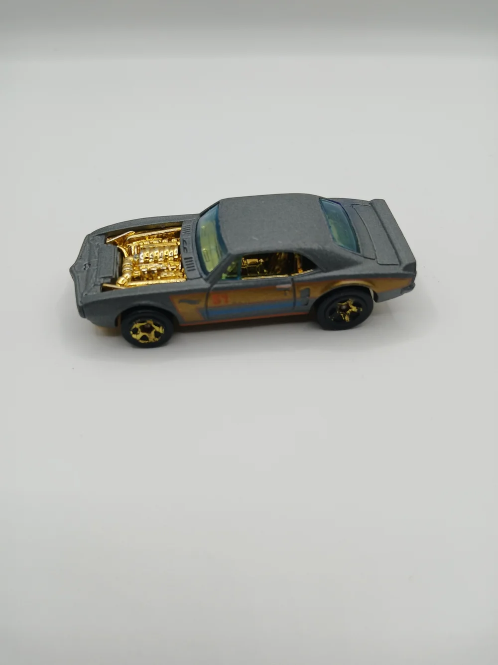 Gray Toy Muscle Car with Gold Engine Detail